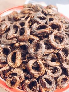 a bowl full of dried and unripe worms