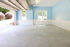 an empty room with blue walls and white trim on the ceiling is painted light blue