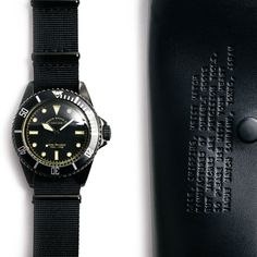 For when you want the look of a $150,000 Rolex Milsub but would rather wear it on your wrist than keep it in a safe. Vague Watch Co.'s Black Submariner has a darkened steel case with a brushed finish that's designed to look aged, along with military style "sword" hands and applied "gilt" hour and permiter markers with vintage patina'd coloring. The 40mm watch has a near-silent Japanese quartz movement, a classic domed crystal, rotating bezel, and screw-down crown. Water resistant up to 100m, it Black Chronometer Watch For Everyday Use, Black Everyday Chronometer Watch, Timeless Black Watch Band With Stainless Steel Clasp, Submariner Watch, Nato Strap, Vintage Rolex, Military Style, 100m, Military Fashion