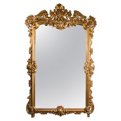 an ornate gold framed mirror against a white background