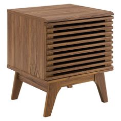 a small wooden cabinet sitting on top of a table