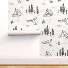 the wall paper is designed to look like it has camping tents and trees on it