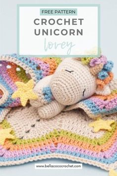 a crochet unicorn is laying on top of a blanket with the words free pattern