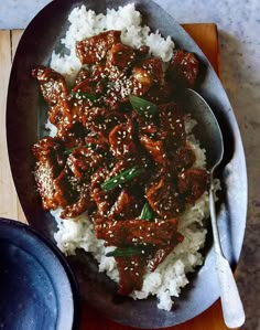 a plate with rice and meat on it