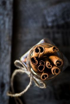 cinnamon sticks in a glass jar tied with twine