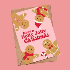 a christmas card with gingerbreads on it and the words have a holly jolly christmas