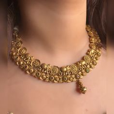 Very gorgeous and elegant matt gold jewellery embedded with reddish pink and green stones Includes necklace and earrings Goes perfectly with sarees and any formal or semi formal clothing. Perfect for wedding occasions. Premium quality and craftsmanship  Necklace length 14-16 inches with an adjustable golden dori at the back Each earring weighs 10 gms  Earrings: Pushback Gold Temple Jewelry Choker With Zari Work, Dual-tone Kundan Temple Necklace For Wedding, Dual-tone Temple Necklace For Wedding And Festive Occasions, Festive Dual-tone Temple Necklace For Wedding, Bollywood Dual-tone Temple Necklace For Wedding, Traditional Brass Choker For Wedding, Bollywood Style Dual-tone Temple Necklace For Wedding, Necklace Set Choker, Jewellery South Indian