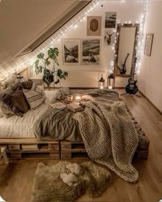 an attic bedroom is decorated with string lights