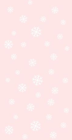 a pink background with white snowflakes on it