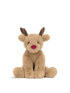 a small stuffed reindeer sitting on the ground