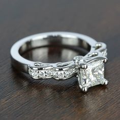 an engagement ring with a princess cut diamond