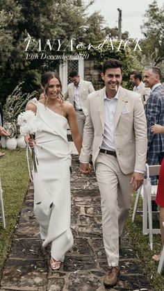 a bride and groom walking down the aisle at their outdoor wedding ceremony in italy, photographed by tanja kark photography