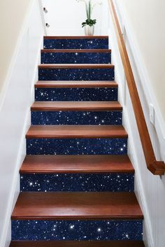 the stairs are painted with blue and white speckles, which also have stars on them