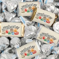 three hersheys are sitting on top of each other in foil wrappers with the words retirement printed on them