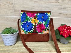 "This Mexican bag is a perfect accessory for any occasion. Each bag is a unique piece embroidered with bright colors and a very bohemian style. Each of our pieces are carefully crafted by artisans from the states of Oaxaca and Chiapas. Our items are made of cotton. We ship anywhere in the word, from Tepic, Nayarit, mx. Care Instructions: Please take care to handwash your items in cold water and hang to dry. Measurement in inches width 10\" high 10.75\" depth 1\"" Casual Brown Embroidered Bag, Multicolor Embroidered Shoulder Bag With Adjustable Strap For Everyday, Casual Brown Embroidered Shoulder Bag, Embroidered Brown Vacation Bag, Brown Embroidered Vacation Bag, Summer Embroidered Brown Bag, Daily Use Multicolor Embroidered Shoulder Bag With Adjustable Strap, Embroidered Brown Shoulder Bag For Vacation, Brown Embroidered Shoulder Bag For Vacation