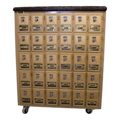 an old wooden cabinet filled with lots of mailboxes and numbers on it's sides