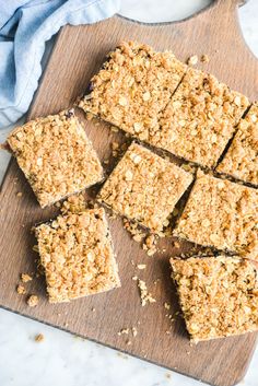 homemade granola bars cut into squares on a cutting board