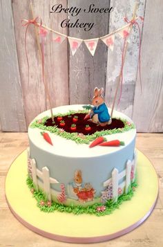 a birthday cake decorated with an image of peter the rabbit