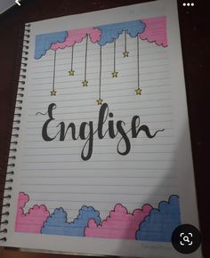 an open notebook with the word english written in cursive writing on top of it