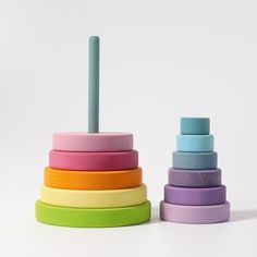 a stack of colorful wooden toys sitting next to each other