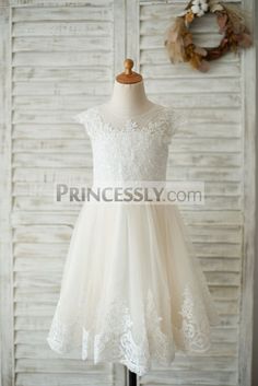 This dress is made of ivory lace and champagne tulle fabric; Sheer illusion tulle neckline with cap sleeves; Lace ... Shop now use NYC2018 for 9% off TODAY! #WeddingFlowers Miniature Bride, Designer Flower Girl Dresses, Lily Dress, Mrs Hudson, Girl Sleeves, Wedding Dresses With Flowers, Girls Pageant Dresses