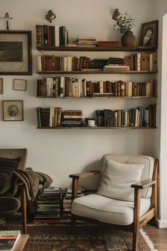 a living room filled with furniture and lots of books on the shelves in front of it