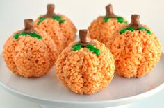 pumpkin rice krispy treats with green sprinkles and jack - o'- lantern faces