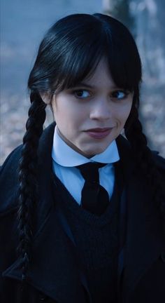 a woman with long black hair wearing a school uniform and braids on her head