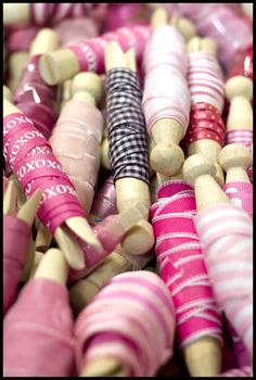 many different colored spools are stacked together