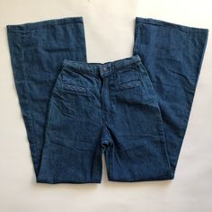 70’s Vintage Women’s Deadstock Maverick Hugh Rise Bell Bottom Jeans! Super High Waist Fit! Braided Waist Detailing W Braided Front Pockets! Bareback Style! Ultra Rare Jem! Tagged Size 25x33, Measures 22x33 - 23x33! Tag Size - Jr Misses 7/8 , Waist 25, Inseam 33 Brand - Maverick Material - 100% Cotton Condition - Deadstock, Vintage New With Tags Waist 22” Relaxed, 23.5” Pulled Taut Rise 12” Hip 35” Inseam 33” Ankle 11.35” X2 #Vintage #Bellbottoms #Bellbottomjeans #Maverick #Long Tags Elephant Fla Retro Fitted Full-length Flare Jeans, Fitted Full-length Retro Flare Jeans, Fitted Full Length Retro Flare Jeans, 1970s High Rise Fitted Bottoms, 1970s Style Full Length Flare Jeans, Jean Vintage, Bottom Jeans, Vintage Women, Bell Bottom