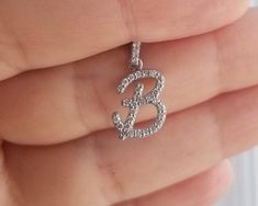 "14K SOLID WHITE GOLD INITIAL PENDANT - NECKLACE WITH DIAMONDS Metal : 14K Solid Gold Necklace Length : 16 inches / 40cm Letter Height : 19.75mm Letter Width : 10.50mm Letter Thickness : 1.9mm Diamond : 36 Diamonds --- Nice White Color Sparkle Diamonds ---- G-H color SI2 clarity Total Carat: 0.36 Carat (Depending on the letter) ---MADE IN USA--- ---All letters from A to Z are available. Please indicate your letter choice in the \"notes to seller\" section on the order. ---This is a beautiful 14K Letter B Necklace, Initial Necklace Diamond, B Necklace, Gold Initial Pendant, Diamond Initial Necklace, Solid Gold Necklace, Initial Pendant Necklace, Necklace Diamond, Gold Initial