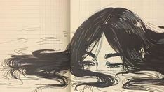 an open book with a drawing of a woman's face and long black hair