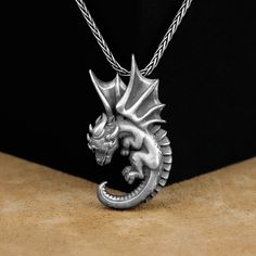 Dragon Pendant, Baby Dragon Unique Silver Necklace, Silver Mythology Jewelry, Cute Winged Baby Dragon Pendant, Dragon Necklace, Gift For Mom Made of 925 silver and handcrafted by hand, this ring is not only an accessory piece that complements your daily elegance, but also has details that will reflect your character and style. It is also a great gift to give to your loved ones on their special days. At SavisSilver, we always give importance to the satisfaction of our customers, we recommend you Silver Fantasy Necklace With Hand Cast, Silver Themed Pendant Jewelry, Collectible Themed Jewelry Pendant, Themed Silver Pendant Jewelry, Collectible Themed Pendant Jewelry, Adjustable Themed Necklace For Collectors, Adjustable Dragon Design Necklace As A Gift, Adjustable Dragon Design Necklace For Gift, Fantasy Hand Cast Jewelry Gift