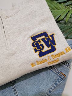 Southwest DeKalb High School Logo Shirt Show your Panther pride with our custom-embroidered Southwest DeKalb High School Logo Shirt! Featuring the iconic SWD logo in bold blue and gold, this shirt is perfect for students, alumni, and supporters alike. The logo is meticulously embroidered on the left chest, ensuring a polished and durable finish that stands the test of time. Make it uniquely yours by adding your name underneath the logo for a personalized touch. Whether you're heading to class, c Cheap Classic School T-shirt, Casual Team Name Shirt Cheap, Cheap College T-shirt With Embroidered Logo, High School Shirt Designs, Yearbook Committee, School Merch, Panther Pride, School Shirt Designs, American High School