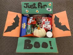 an open halloween box with candy and candies