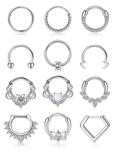 six different types of piercing rings with diamonds on each side and an open nose ring