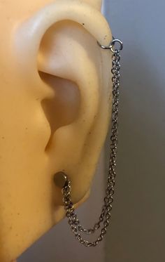 Helix to lobe chain, dangle chain that attaches to helix and lobe piercing Ear Piercing Chain Handmade ear piercing chain made from stainless steel ⛓ **Chain only** does not come with hoops or studs** Hand Made in standard length which is 8cm but can be made longer or shorter for personal needs! IMPORTANT- please message me if you require different measurements as I cannot except returns so it is down to you to read the description!* For lobe/ helix / cartilage piercings 📷Photos are reference o Helix To Lobe Chain Earring, Ear Chain Piercing, Helix And Lobe Piercing, Ear Piercing Chain, Chain Piercing, Ear Lobe Piercings, Chain Jewellery