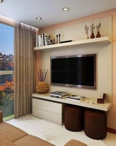 a living room with a flat screen tv on the wall