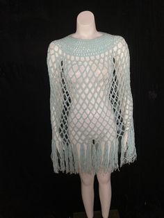 1970's light blue wide knit pull over shawl with fringe hem. Has a couple of sporadic stain spots but is sturdy and wearable. I have not tried to clean. Size medium or smaller 60" or smaller bust 21" head hole circumference 36" total length Summer Long Sleeve Poncho With Fringe, Summer Poncho With Fringe, Spring Fringe Poncho One Size, Long Sleeve Fringe Poncho, Blue One-size Poncho With Fringe, Blue Fringe Poncho One Size, One Size Blue Poncho With Fringe, Fringe Shawl, Open Knit