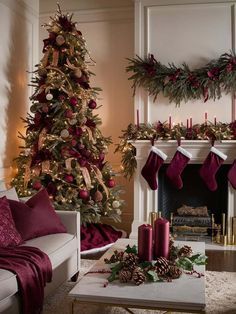 a living room filled with furniture and a christmas tree in front of a fire place