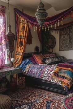 a bed sitting in a bedroom next to a window filled with curtains and rugs