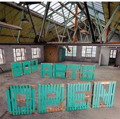 an empty warehouse with lots of blue chairs