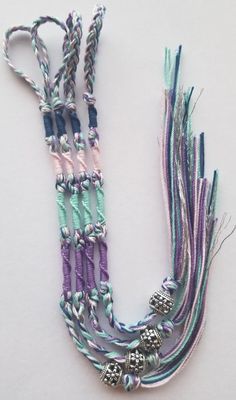 "Traditionally tied Navy blue, light pink, teal, purple and silver colored set of 4 tzitzit.  Made with 100% cotton.  Length is around 11.50- 12 in.  I can make them longer or shorter, especially if you need a shorter length for children.  Please message me if you need a different length. These can be used without hooks by attaching to belt loops using loop knot. The loop is braided to make it strong. They can also be attached to a swivel hook to clip onto belt loops or the tops of pants waist. Handmade Lavender Friendship Bracelet For Gift, Purple Macrame Friendship Bracelets As Gift, Bible Jewelry, Loop Knot, Jackets Sweaters, Swivel Hook, Purple And Silver, Safety Pins, Trail Riding