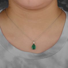 "Genuine 3.00 Ct Pear Shape Emerald Diamond Pendant Necklace Solid 14K Yellow Gold Minimalist Certified Necklace Birthstone Jewelry Gift Idea ≫ Features * Items Code:- SGN00894 * 18K also available - Additional fees may apply) * More options in gold color: Rose, yellow, White gold * Metal: Solid 14K Yellow Gold with stamped * Diamonds Weight: 0.11 Ct * Diamond Color: G-H * Diamond Clarity: SI1 * Diamond Cut: Brilliant (Excellent cut) * Emerald Weight: 3.00 Ct  * Measurement:-   Chain Length:- 16 Emerald Diamond Pendant, Princess Jewelry, Diamond Evil Eye, Necklace Birthstone, Emerald Pendant, Anniversary Jewelry, Rose Yellow, Emerald Gemstone, Diamond Pendant Necklace