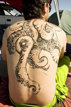 a man with an octopus tattoo on his back