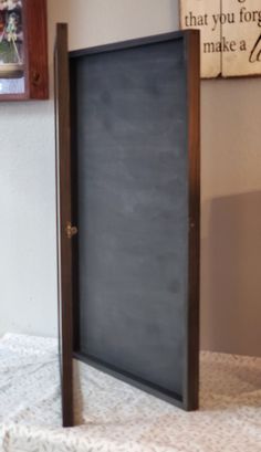 a blackboard in the corner of a room