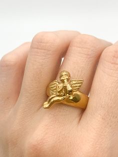 Gold Angel Ring made of Gold Vermeil: 18k Gold over Solid 925 Sterling Silver ☞ made to last. Matching Pendant & Matching Earrings ☞ please ask me Details:• Gold Cupid Ring• Dimensions: Band width 2.8mm, thickness 1mm•18k Gold Vermeil SKU 1666 Personalized Spiritual Gold Rings, Gold Spiritual Rings With Polished Finish, Unique Gold Jewelry With Halo Detail, Unique Gold Halo Jewelry, Spiritual Gold-plated Yellow Gold Rings, Spiritual Gold-plated Rings As Gifts, Spiritual Yellow Gold-plated Rings, Spiritual Style Yellow Gold-plated Rings, Symbolic Gold Rings As Gift