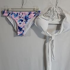 Young Ladies Swim Wear Bikini Panties Pink Floral Top White Tie-Up Size Xs By Shekini White Stretch Triangle Top Tankini, White Halter Top For Summer Pool, White Halter Top For Summer Pool Events, White Sleeveless Halter Top For Pool, White Sleeveless Halter Top For Poolside, White Triangle Top Tankini For Beach Party, White Tankini For Pool Use In Spring, White Halter Neck Tankini For Pool, White Halter Neck Tankini For Beach Season