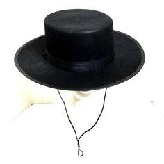 Zorro Classic Black Spanish Hat Zorro’s Hat Is A Signature Part Of His Look Complete Your Costume With Classic Hat Great For Many Costumes Spanish - Gaucho - Amish - Flat Top - Cinco De Mayo - Costume Hats Hat Comes With Chin Ties Black Satin Ribbon Hat Band 100% Polyester One Size Fits Most 23“ Diameter Flat - Wide Brim - 2 ¾” Crown 3.5” Black Brimmed Mini Hats For Rodeo, Black Mini Hats With Short Brim For Rodeo, Black Mini Hat With Short Brim For Rodeo, Black High Crown Fedora For Winter, Black Boater Hat With Short Brim For Rodeo, Black Boater Hat For Rodeo With Short Brim, Black Wide Brim Costume Hat For Winter, Black Wide Brim Costume Hat, Adjustable Black High Crown Boater Hat