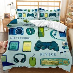 a bed covered in a blue and green comforter next to a computer mouse, keyboard and headphones